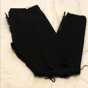 Distressed black skinny jeans